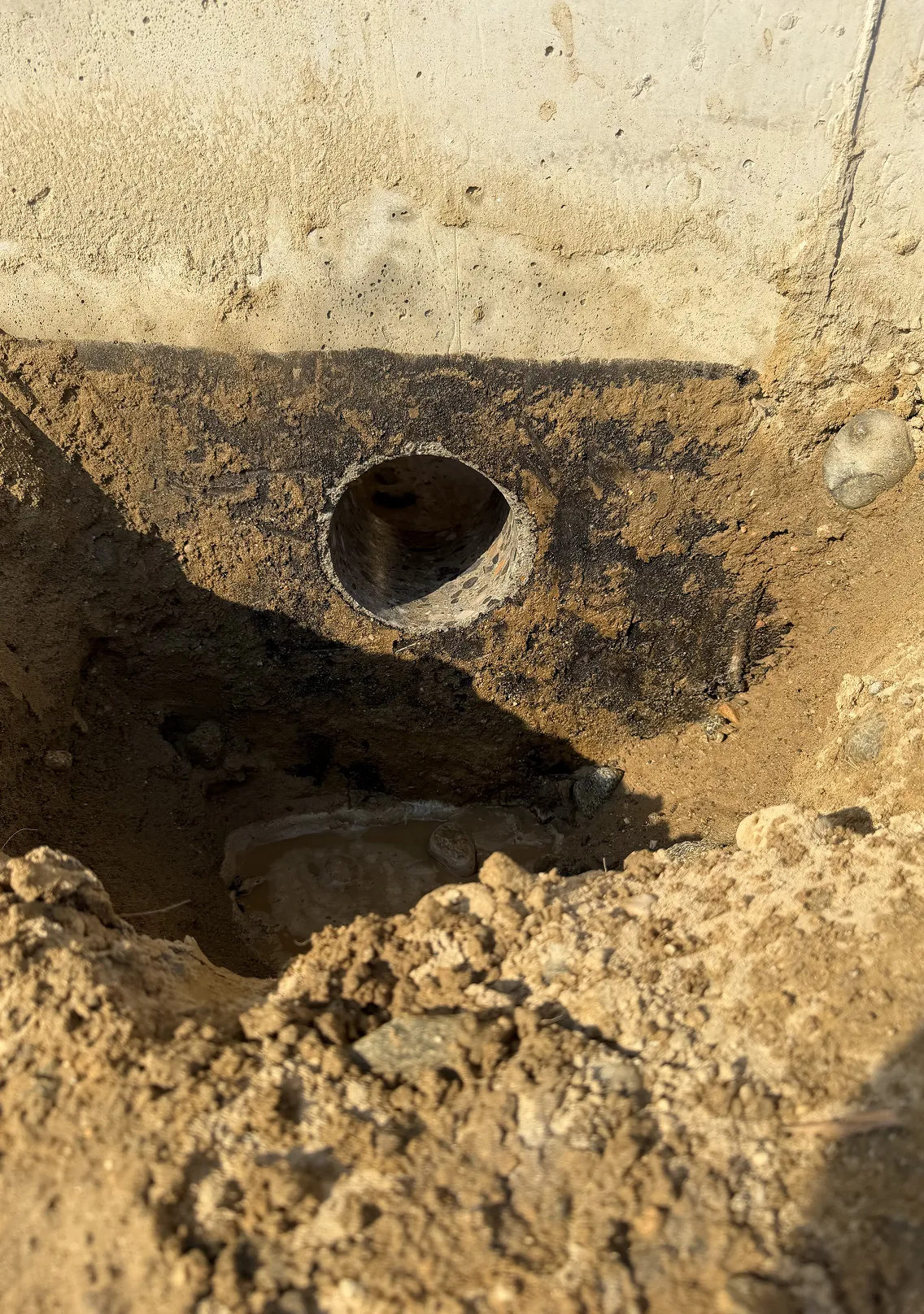 Core drilled hole through concrete foundation